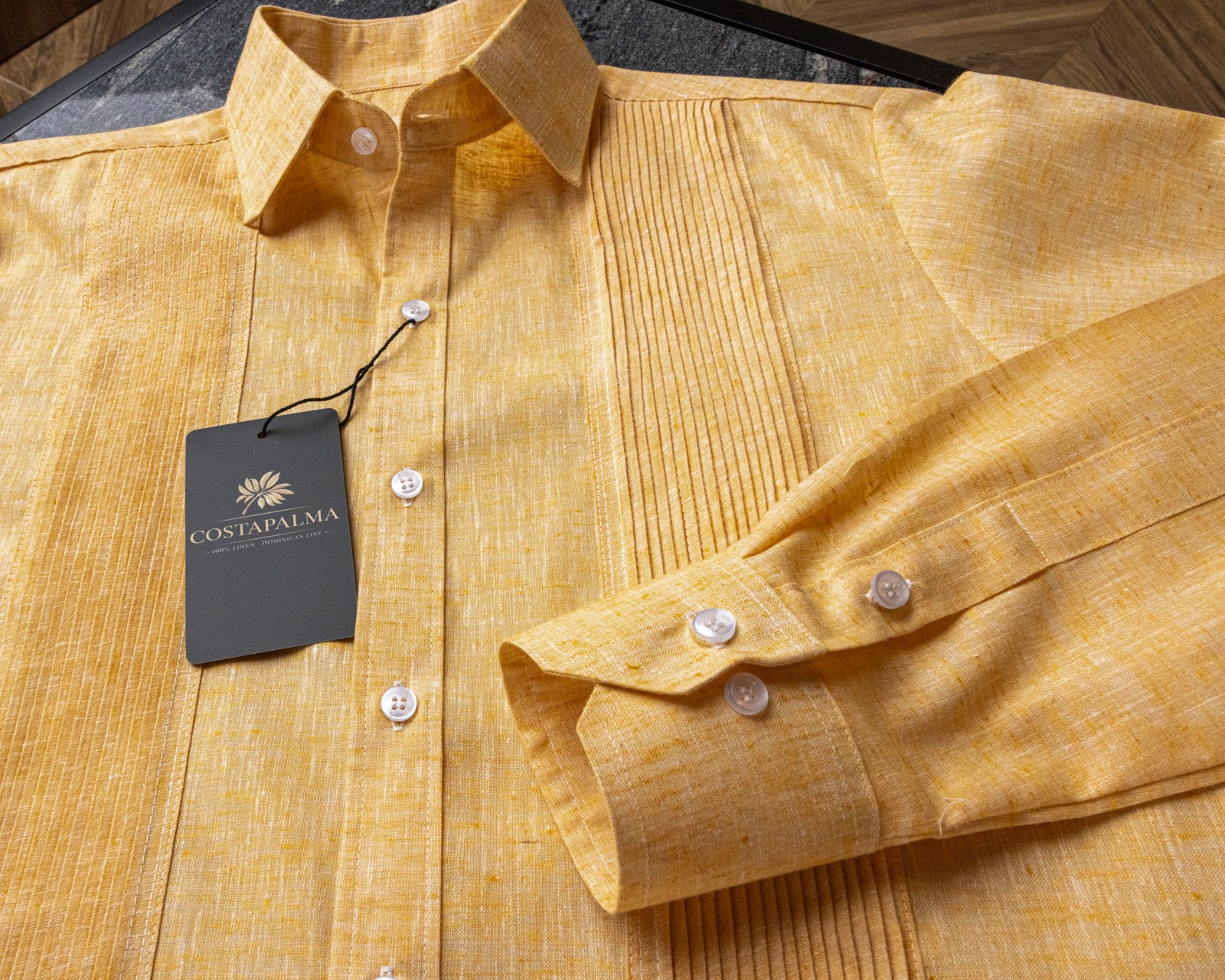 Mother-of-pearl buttons, hand-sewn