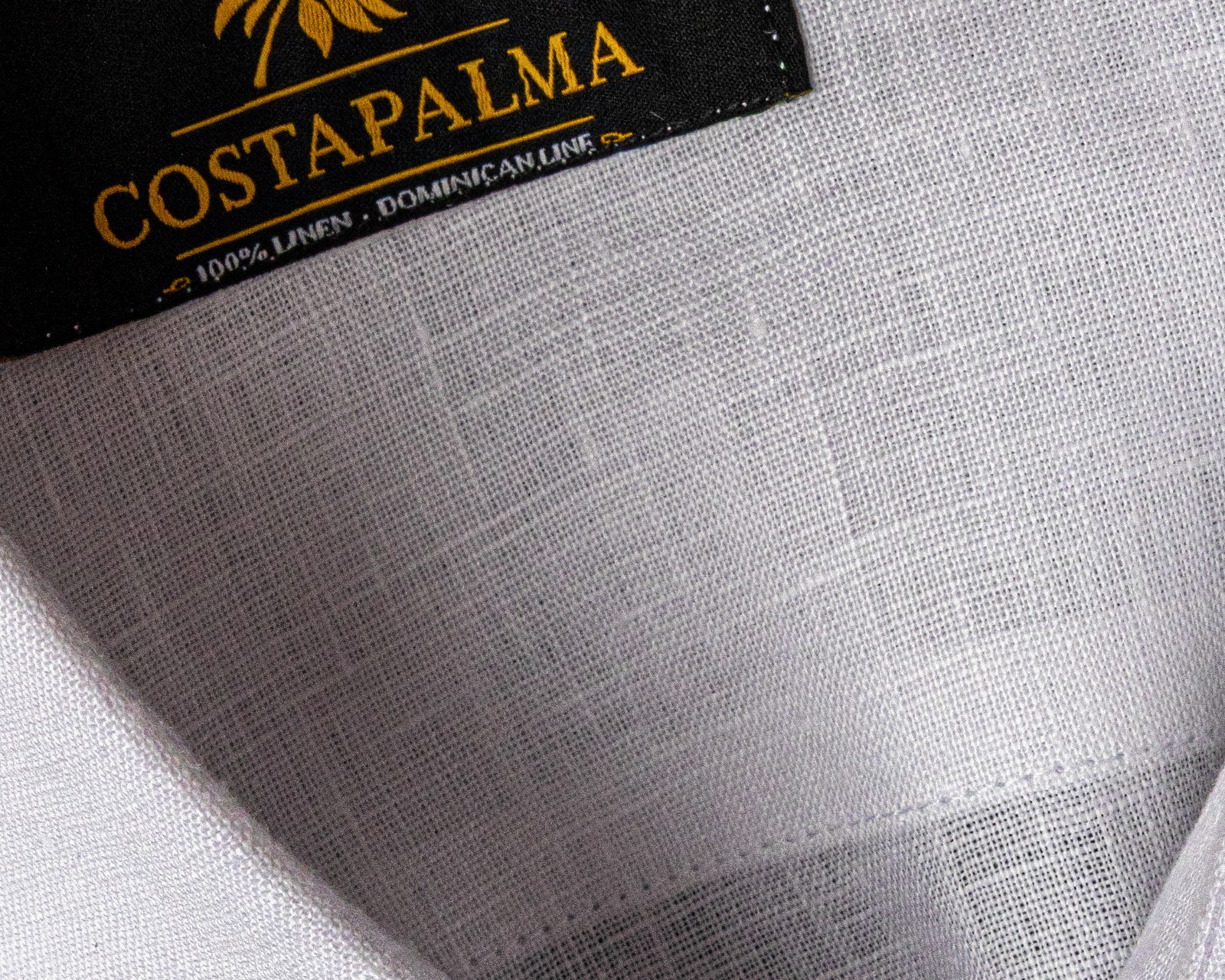 Atelier label on white linen